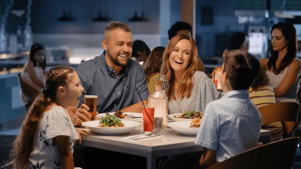 Happy customers enjoying a restaurant meal and experiencing good value
