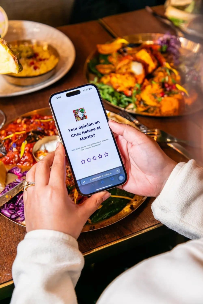 Restaurant customer leaving an online review on a smartphone