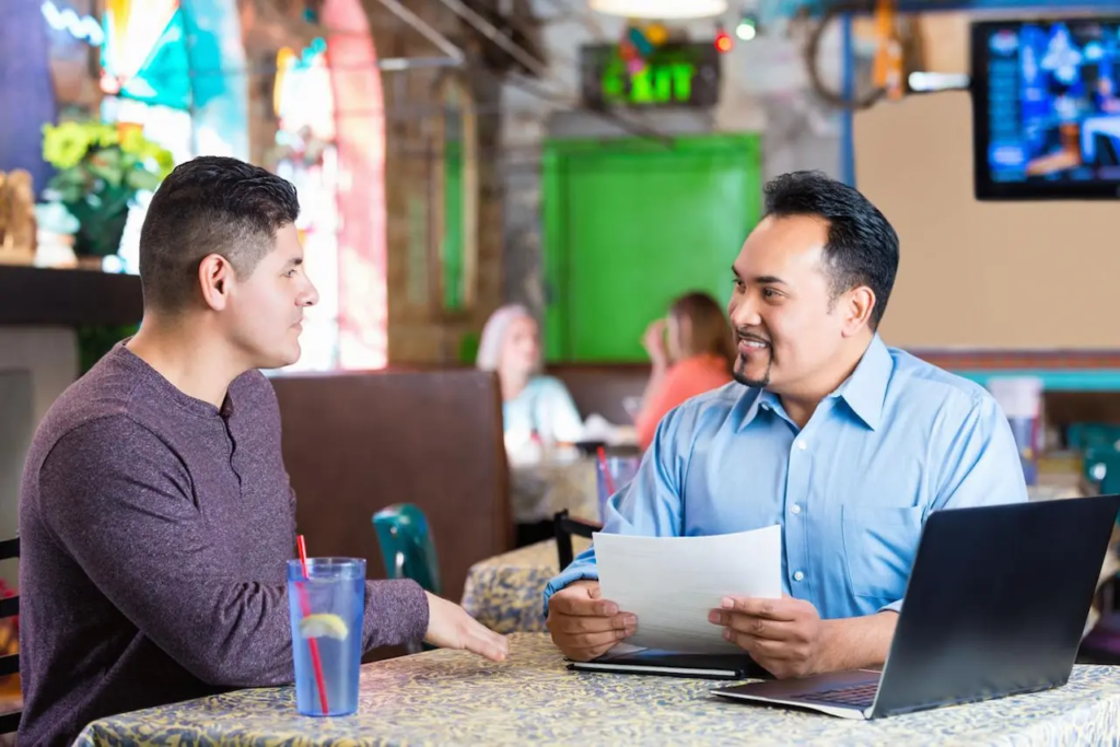 Restaurant manager interviewing a job candidate for the right restaurant employee